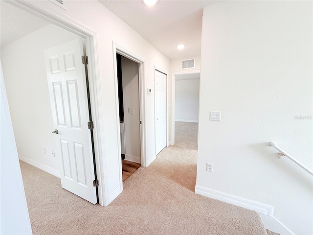 222 Carpenters Way Unit 71, Lakeland, FL 33805 - corridor featuring carpet floors, baseboards, and recessed lighting