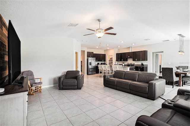 146 Rain Berry Ave, Ruskin, FL 33570 - living area featuring light tile patterned flooring and ceiling fan