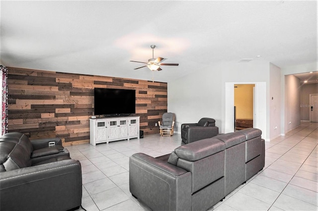 146 Rain Berry Ave, Ruskin, FL 33570 - living room with a ceiling fan, wooden walls, light tile patterned floors, vaulted ceiling, and an accent wall