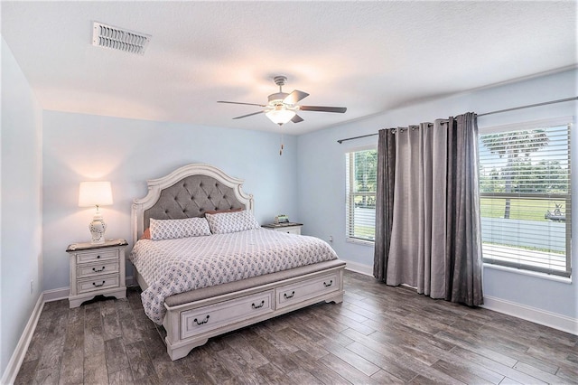 146 Rain Berry Ave, Ruskin, FL 33570 - bedroom with dark wood finished floors and ceiling fan
