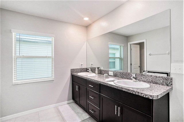 146 Rain Berry Ave, Ruskin, FL 33570 - full bath with double vanity and tile patterned flooring
