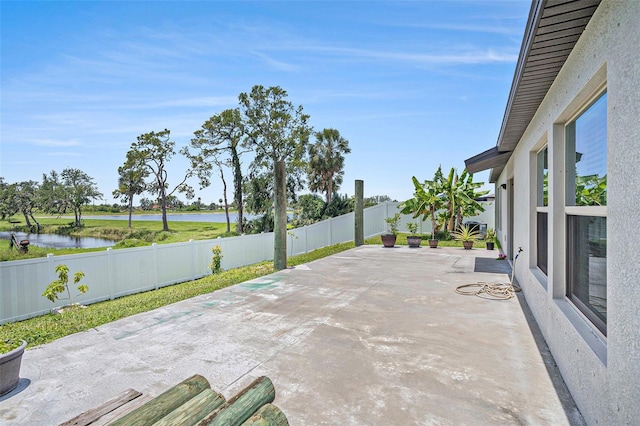 146 Rain Berry Ave, Ruskin, FL 33570 - fenced backyard with a water view and a patio