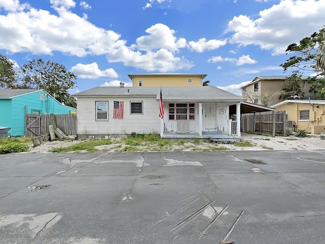 131 92nd Ave, Treasure Island, FL 33706 - view of front of home with a porch and a carport