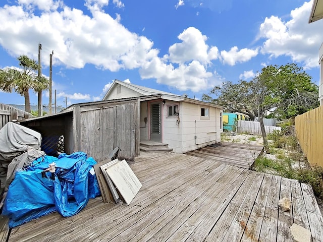 131 92nd Ave, Treasure Island, FL 33706 - wooden deck featuring a fenced backyard