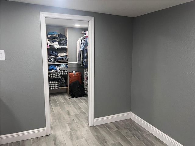 1631 St Mary Dr, Dunedin, FL 34698 - hallway with wood finished floors and baseboards