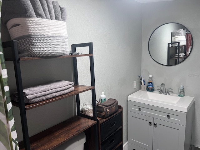 1631 St Mary Dr, Dunedin, FL 34698 - bathroom featuring vanity and a textured wall