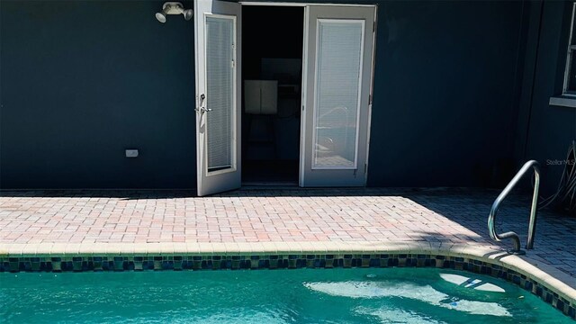 1631 St Mary Dr, Dunedin, FL 34698 - swimming pool featuring a patio area