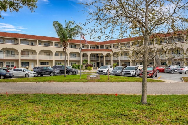 2434 Australia Way E Unit 38, Clearwater, FL 33763 - view of apartment building / complex with uncovered parking