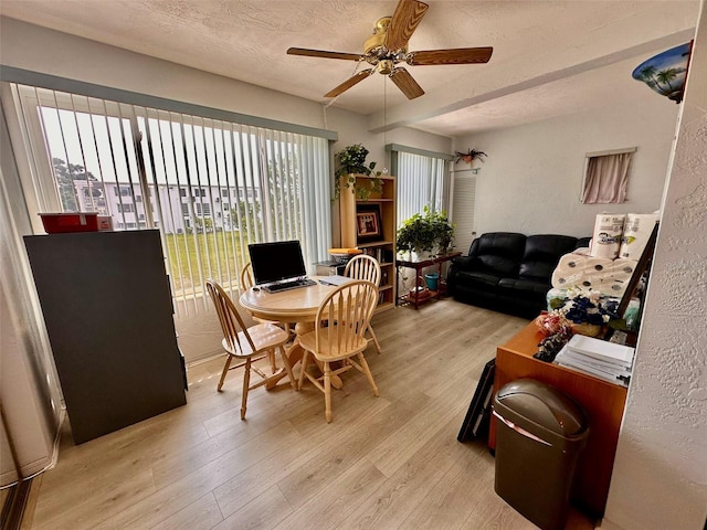 2434 Australia Way E Unit 38, Clearwater, FL 33763 - dining space with wood finished floors, ceiling fan, and a textured ceiling