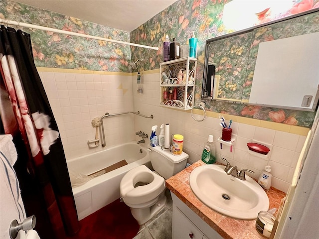 2434 Australia Way E Unit 38, Clearwater, FL 33763 - bathroom with wallpapered walls, vanity, shower / tub combo with curtain, toilet, and a wainscoted wall