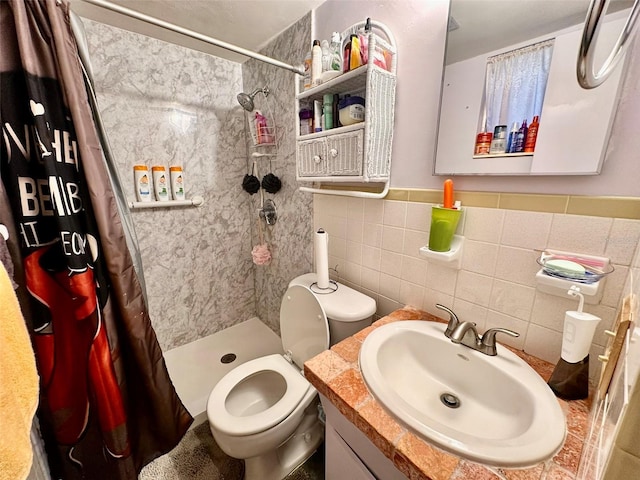2434 Australia Way E Unit 38, Clearwater, FL 33763 - bathroom featuring tile walls, a shower stall, vanity, and toilet