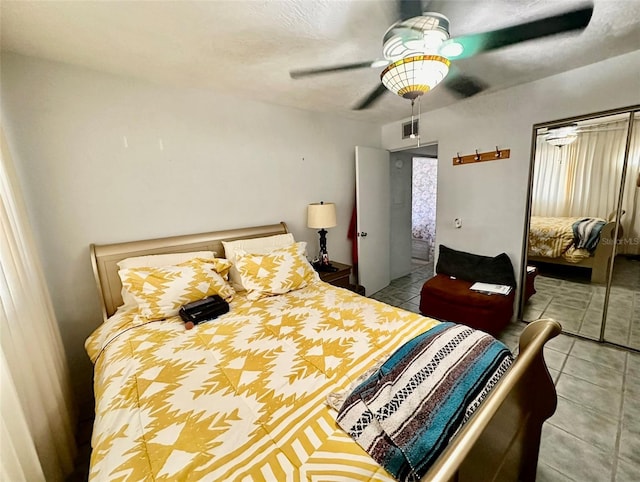 2434 Australia Way E Unit 38, Clearwater, FL 33763 - tiled bedroom featuring a closet and a ceiling fan