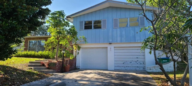 3717 Mckay Creek Dr, Largo, FL 33770 - view of front of house featuring concrete driveway and a garage
