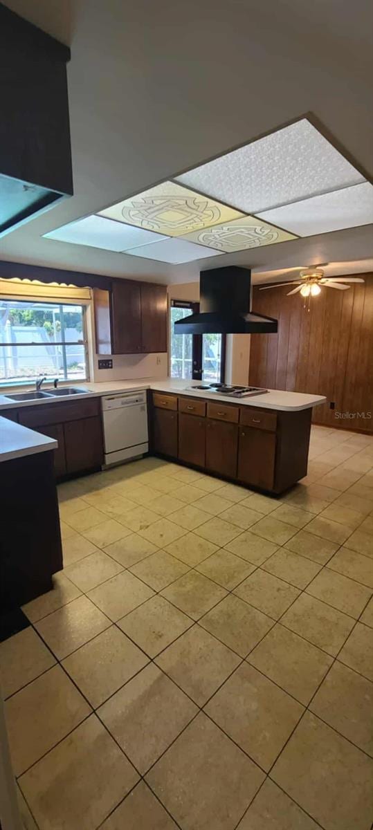 3717 Mckay Creek Dr, Largo, FL 33770 - kitchen featuring white dishwasher, ventilation hood, a sink, electric stovetop, and light countertops