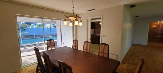 3717 Mckay Creek Dr, Largo, FL 33770 - carpeted dining area featuring a chandelier
