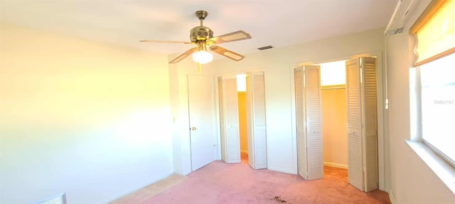 3717 Mckay Creek Dr, Largo, FL 33770 - unfurnished bedroom featuring light colored carpet, a closet, a ceiling fan, and baseboards