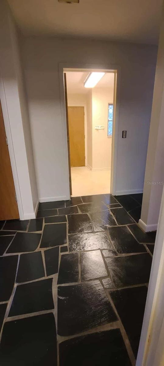 3717 Mckay Creek Dr, Largo, FL 33770 - corridor with baseboards