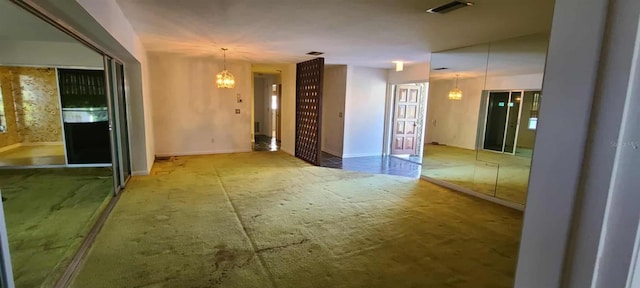 3717 Mckay Creek Dr, Largo, FL 33770 - carpeted empty room featuring a chandelier and baseboards