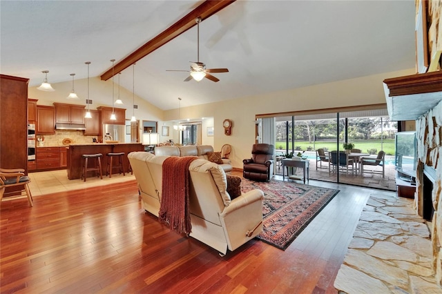 414 Summit Chase Dr, Valrico, FL 33594 - living area featuring light wood finished floors, a ceiling fan, beamed ceiling, and high vaulted ceiling