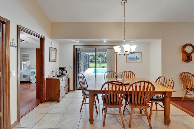414 Summit Chase Dr, Valrico, FL 33594 - dining area featuring light tile patterned flooring, a chandelier, and baseboards