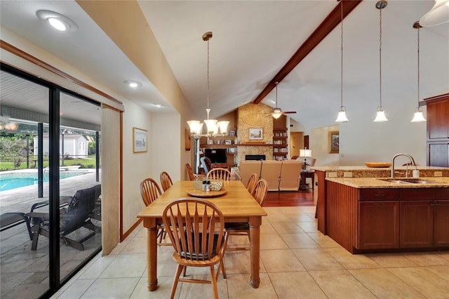 414 Summit Chase Dr, Valrico, FL 33594 - dining room featuring ceiling fan, a large fireplace, and light tile patterned flooring