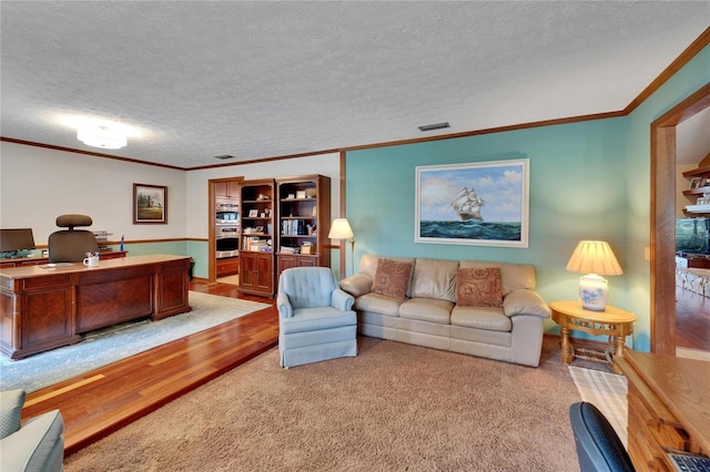 414 Summit Chase Dr, Valrico, FL 33594 - living room with carpet flooring, a desk, ornamental molding, and a textured ceiling