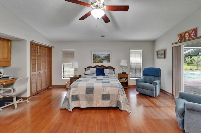 414 Summit Chase Dr, Valrico, FL 33594 - bedroom with access to exterior, light wood-style flooring, a ceiling fan, baseboards, and lofted ceiling