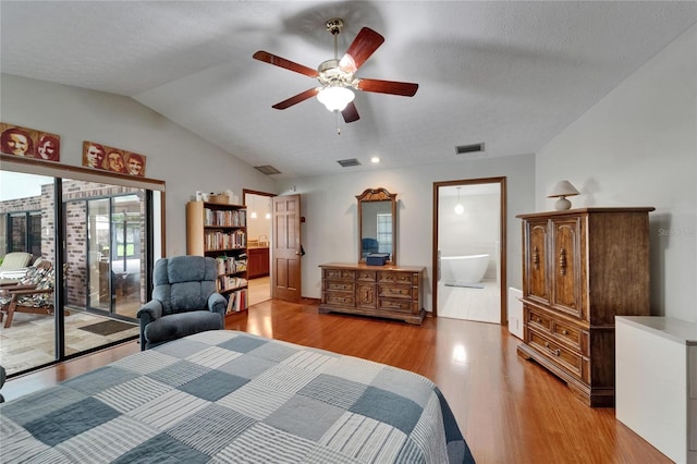 414 Summit Chase Dr, Valrico, FL 33594 - bedroom with access to outside, light wood-style flooring, connected bathroom, vaulted ceiling, and a textured ceiling