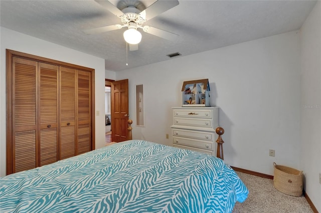 414 Summit Chase Dr, Valrico, FL 33594 - carpeted bedroom with a closet, baseboards, ceiling fan, and a textured ceiling
