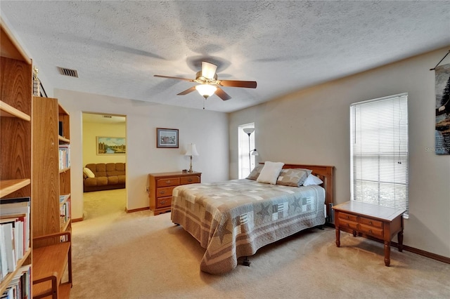 414 Summit Chase Dr, Valrico, FL 33594 - bedroom with light carpet, baseboards, a textured ceiling, a ceiling fan, and connected bathroom