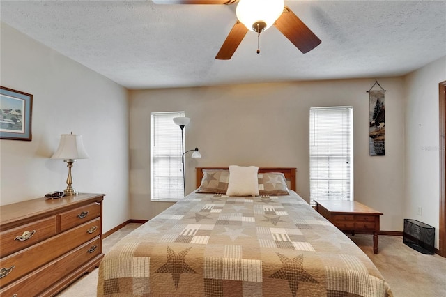 414 Summit Chase Dr, Valrico, FL 33594 - bedroom featuring light carpet, a textured ceiling, baseboards, and a ceiling fan