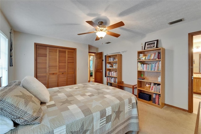 414 Summit Chase Dr, Valrico, FL 33594 - bedroom with a closet, light colored carpet, ceiling fan, ensuite bath, and baseboards