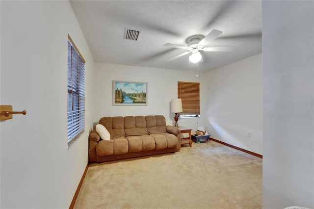 414 Summit Chase Dr, Valrico, FL 33594 - carpeted living area with baseboards, a ceiling fan, and a textured ceiling