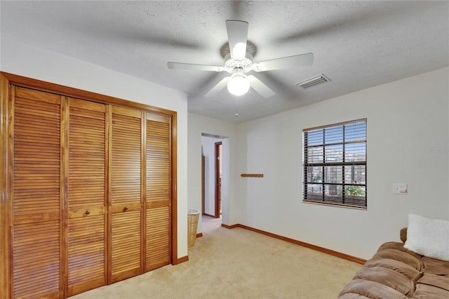 414 Summit Chase Dr, Valrico, FL 33594 - sitting room featuring light carpet, a ceiling fan, baseboards, and a textured ceiling
