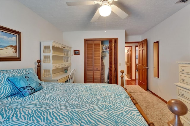 414 Summit Chase Dr, Valrico, FL 33594 - bedroom with carpet floors, a closet, a textured ceiling, a ceiling fan, and baseboards