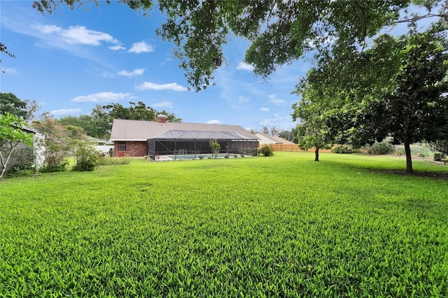 414 Summit Chase Dr, Valrico, FL 33594 - view of grassy yard featuring a lanai