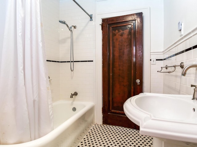 4521 W Azeele St, Tampa, FL 33609 - full bathroom with a sink, shower / bath combination with curtain, and tile walls