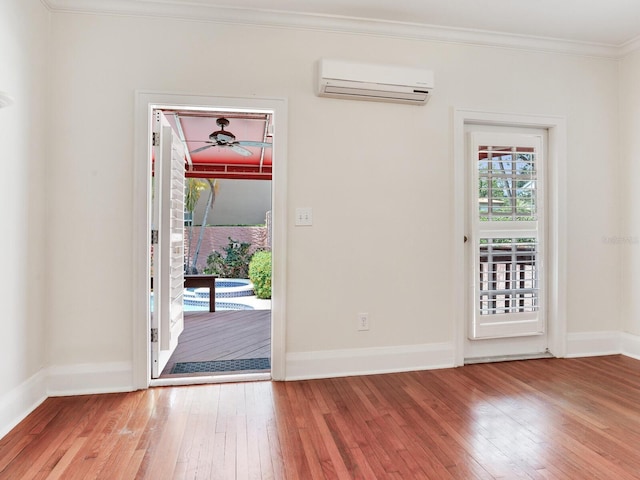 4521 W Azeele St, Tampa, FL 33609 - foyer entrance with a wall mounted AC, hardwood / wood-style floors, crown molding, baseboards, and a ceiling fan