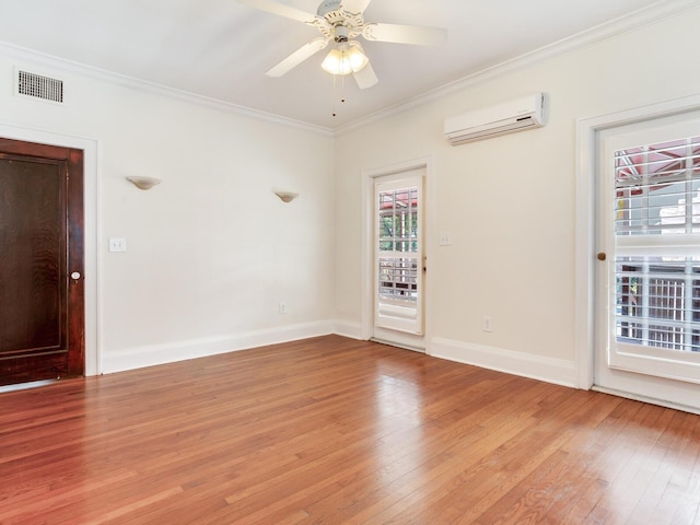 4521 W Azeele St, Tampa, FL 33609 - spare room featuring a wall mounted air conditioner, light wood-style flooring, crown molding, baseboards, and ceiling fan