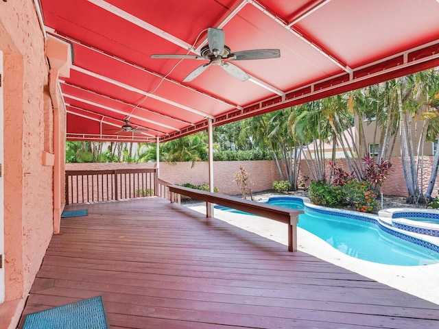 4521 W Azeele St, Tampa, FL 33609 - wooden deck featuring ceiling fan, a fenced backyard, and a pool with connected hot tub