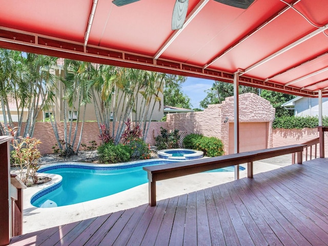 4521 W Azeele St, Tampa, FL 33609 - view of swimming pool with a deck, a fenced backyard, an outbuilding, and an in-ground hot tub