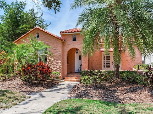 4521 W Azeele St, Tampa, FL 33609 - mediterranean / spanish-style home featuring a tiled roof and stucco siding