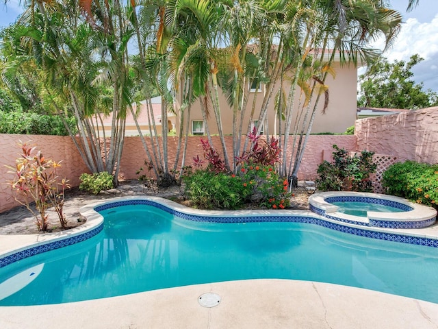 4521 W Azeele St, Tampa, FL 33609 - view of pool featuring a fenced backyard and a pool with connected hot tub