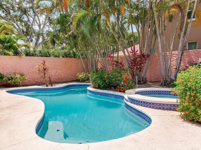 4521 W Azeele St, Tampa, FL 33609 - view of pool with a fenced backyard and a pool with connected hot tub