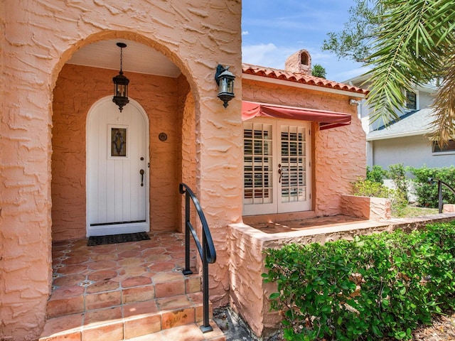 4521 W Azeele St, Tampa, FL 33609 - property entrance with a tile roof