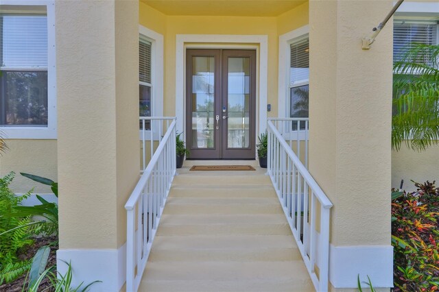 6468 Rubia Cir, Apollo Beach, FL 33572 - property entrance featuring french doors and stucco siding
