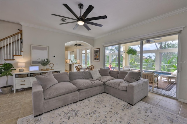 6468 Rubia Cir, Apollo Beach, FL 33572 - living room with ornamental molding, a ceiling fan, light tile patterned floors, and stairway
