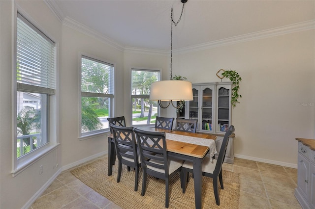 6468 Rubia Cir, Apollo Beach, FL 33572 - dining room featuring crown molding, baseboards, and light tile patterned floors