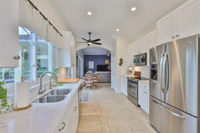 6468 Rubia Cir, Apollo Beach, FL 33572 - kitchen with stainless steel appliances, a sink, ceiling fan, plenty of natural light, and recessed lighting