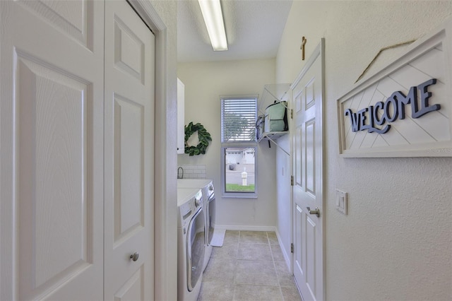 6468 Rubia Cir, Apollo Beach, FL 33572 - laundry area with washing machine and clothes dryer, light tile patterned flooring, and baseboards